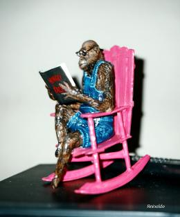 83_sculptures_monkey_on_a_rocking_chain_reading_the_bible.jpg